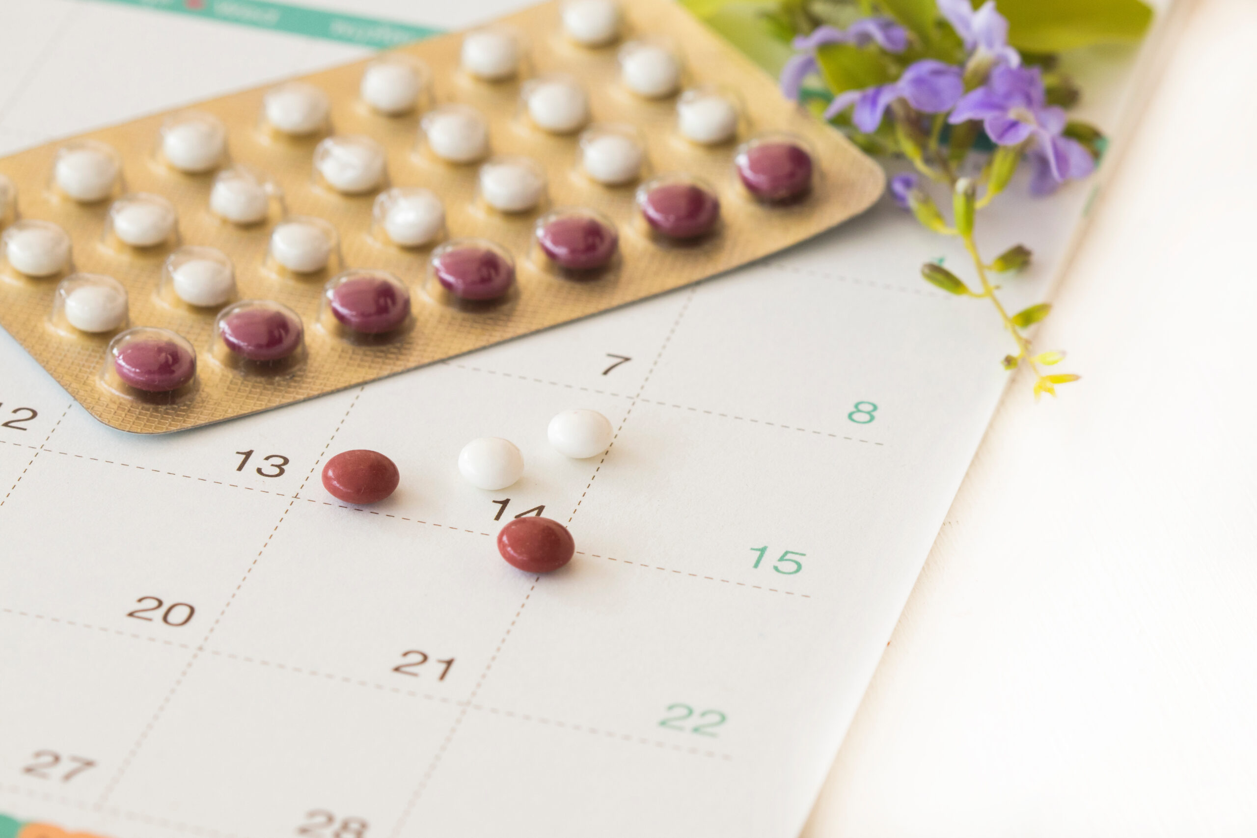 birth control pills of lifestyle woman protect with calendar arrangement flat lay style on background white